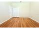 Bedroom featuring wood floors, closet, and door at 12510 Sparkleberry Rd, Tampa, FL 33626