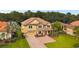 Aerial view of two-story house with driveway and landscaping at 17809 Saint Lucia Isle Dr, Tampa, FL 33647