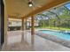 Spacious covered patio overlooking a refreshing pool and spa, perfect for outdoor entertaining at 17809 Saint Lucia Isle Dr, Tampa, FL 33647