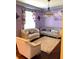 Elegant living room with purple walls and plush furniture at 32502 Summerglade Dr, Wesley Chapel, FL 33545