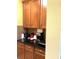 Kitchen with dark countertop and wood cabinets at 32502 Summerglade Dr, Wesley Chapel, FL 33545