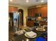 Modern kitchen with stainless steel appliances and granite countertops at 32502 Summerglade Dr, Wesley Chapel, FL 33545