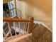 Wooden staircase with carpeted steps and railing at 32502 Summerglade Dr, Wesley Chapel, FL 33545