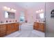 Elegant bathroom with a corner soaking tub and dual vanities at 8044 Stirling Falls Cir, Sarasota, FL 34243