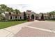 Community clubhouse with landscaping and palm trees at 8044 Stirling Falls Cir, Sarasota, FL 34243