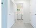 Bright laundry room with washer, dryer, and shelving at 810 Ace Outlaw Ave, Ruskin, FL 33570