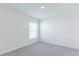 Simple bedroom with gray carpet and large window at 810 Ace Outlaw Ave, Ruskin, FL 33570