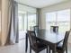 Dining area with table and chairs, sliding door access to patio at 810 Ace Outlaw Ave, Ruskin, FL 33570