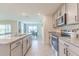 Modern kitchen featuring granite countertops and stainless steel appliances at 810 Ace Outlaw Ave, Ruskin, FL 33570