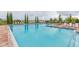 Inviting community pool with plenty of lounge chairs at 810 Ace Outlaw Ave, Ruskin, FL 33570