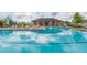 Community pool with a clubhouse and plenty of lounge chairs at 810 Ace Outlaw Ave, Ruskin, FL 33570