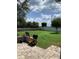 Spacious backyard with grassy area, patio, and privacy fence at 32502 Summerglade Dr, Wesley Chapel, FL 33545