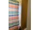 Clean bathroom with striped shower curtain and tile surround at 32502 Summerglade Dr, Wesley Chapel, FL 33545