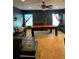 Game room with pool table and sectional sofa at 32502 Summerglade Dr, Wesley Chapel, FL 33545