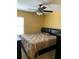 King-size bed in spacious bedroom with ceiling fan and window at 32502 Summerglade Dr, Wesley Chapel, FL 33545