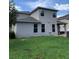 Two-story house exterior with gray siding and a neatly landscaped yard at 32502 Summerglade Dr, Wesley Chapel, FL 33545