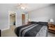 Bedroom with large bed, ceiling fan and access to closet at 184 Valencia Cir, St Petersburg, FL 33716