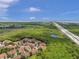 Aerial view of community with lush landscape and highway access at 184 Valencia Cir, St Petersburg, FL 33716