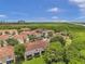 Aerial view of townhome community near water and highway at 184 Valencia Cir, St Petersburg, FL 33716