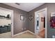Hallway with access to closets and bedrooms at 184 Valencia Cir, St Petersburg, FL 33716
