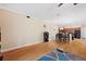 Open concept living room with hardwood floors and view of kitchen at 184 Valencia Cir, St Petersburg, FL 33716