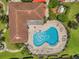 Community pool with surrounding patio and lounge chairs at 184 Valencia Cir, St Petersburg, FL 33716