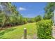 Landscaped backyard with lush greenery and a grassy area at 184 Valencia Cir, St Petersburg, FL 33716