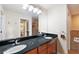 Bathroom with double vanity, large mirror, and separate shower and tub at 184 Valencia Cir, St Petersburg, FL 33716