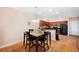 Small dining area with kitchen and hardwood floors at 184 Valencia Cir, St Petersburg, FL 33716