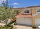 Townhome with attached garage and Spanish-style roof at 184 Valencia Cir, St Petersburg, FL 33716