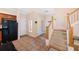 View of entryway with staircase and kitchen access at 184 Valencia Cir, St Petersburg, FL 33716