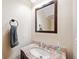 Small bathroom with granite vanity and a framed mirror at 184 Valencia Cir, St Petersburg, FL 33716