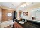 Bathroom with granite countertop, tub, and shower at 184 Valencia Cir, St Petersburg, FL 33716