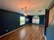 Charming dining room with hardwood floors and arched window at 4031 Quail Briar Dr, Valrico, FL 33596