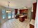 Kitchen with island, stainless steel appliances, and access to pool at 4031 Quail Briar Dr, Valrico, FL 33596