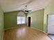 Large bedroom with an arched window and ceiling fan at 4031 Quail Briar Dr, Valrico, FL 33596