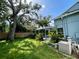 Large backyard with lush grass and trees at 4031 Quail Briar Dr, Valrico, FL 33596