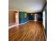 Open living room with hardwood floors and access to other rooms at 4031 Quail Briar Dr, Valrico, FL 33596