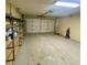 Two-car garage with storage shelving at 4031 Quail Briar Dr, Valrico, FL 33596