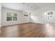 Spacious living room featuring hardwood floors and ample natural light at 31421 Anniston Dr, Wesley Chapel, FL 33543