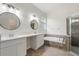 Bathroom boasts double vanity, soaking tub, and walk-in shower at 31421 Anniston Dr, Wesley Chapel, FL 33543
