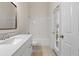 Bathroom with tub, vanity, and access to backyard at 31421 Anniston Dr, Wesley Chapel, FL 33543