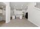 Modern kitchen with white cabinets, breakfast bar and stainless steel appliances at 31421 Anniston Dr, Wesley Chapel, FL 33543