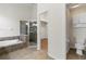 Bathroom features a large soaking tub, walk-in shower, and toilet at 31421 Anniston Dr, Wesley Chapel, FL 33543