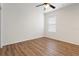 Spacious bedroom featuring wood-look floors and a ceiling fan at 31421 Anniston Dr, Wesley Chapel, FL 33543