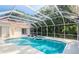 Inviting screened-in pool and spa with plenty of space for relaxation at 17812 Arbor Greene Dr, Tampa, FL 33647