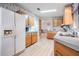 Kitchen with wood cabinets and laminate flooring at 37700 Neukom Ave, Zephyrhills, FL 33541