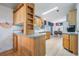 Kitchen with light wood cabinets and a breakfast bar at 37700 Neukom Ave, Zephyrhills, FL 33541