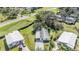 Aerial view of two homes with lush green lawns at 37700 Neukom Ave, Zephyrhills, FL 33541