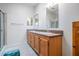 Bathroom with double vanity and a shower at 37700 Neukom Ave, Zephyrhills, FL 33541